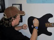 489  Ricky signing the wall guitar.JPG